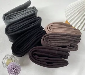 Detailed view of thick fleece-lined winter thermal leggings featuring soft ribbed texture.