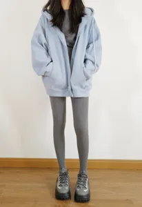 Grey tights detail shot featuring thick knit texture and comfortable fit for winter wear.