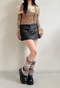Gradient knit leg warmers styled with outfit, showcasing cozy texture and trendy aesthetic detail.