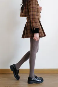 Grey cable-knit tights for women, thick thermal winter hosiery, vintage patterned style.