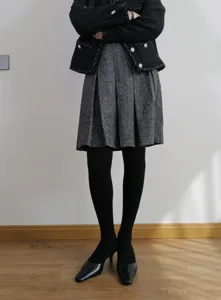 Black ribbed tights for women, thick fleece lined winter leggings, retro pleated skirt outfit.