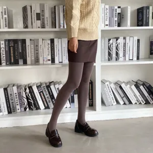 Brown fleece-lined thermal tights for women, thick cozy winter stirrup pantyhose for daily wear.
