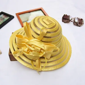 Yellow organza women sun hat detail, elegant beach hat with ribbon bow for summer vacation.
