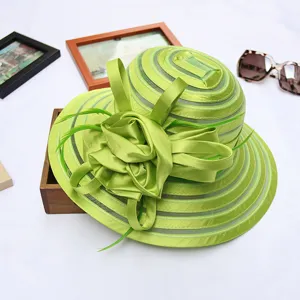 Elegant green organza sun hat detail showcasing intricate flower and bow design for summer.