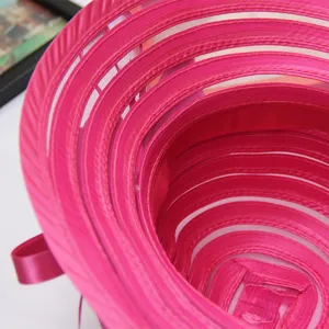 Detail of fuchsia organza sun hat interior texture, elegant summer beach dress hat style.