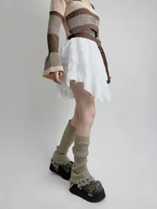 Knit distressed leg warmers with tassel details, stylish slouchy calf socks for women.