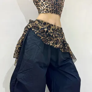 Detailed view of the leopard print hip scarf and matching crop top for street dance and fashion wear.