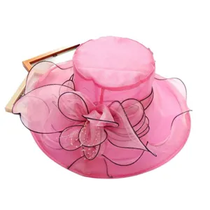 Women pink organza sun hat with elegant floral mesh design for summer beach and outdoor travel.