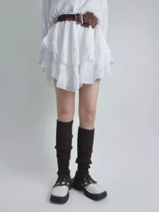 Distressed knit leg warmers for women, grunge style brown slouch socks with tassels.
