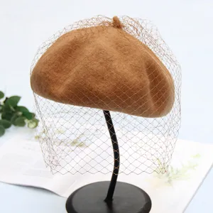 Chic brown wool beret with delicate mesh veil, vintage British style painter hat for women autumn.