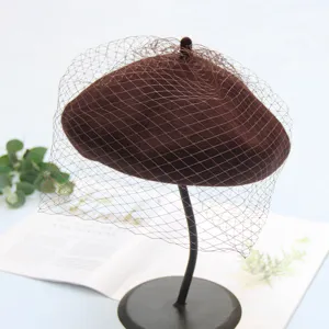 Stylish brown wool beret hat with vintage veil mesh, elegant autumn winter headwear.