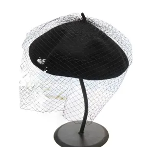 Classic black wool beret with elegant face veil, stylish vintage retro painter hat for women.
