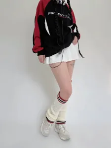 Scaldamuscoli in maglia accoglienti con righe classiche per look autunnali e invernali.