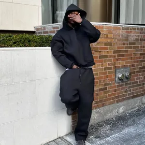 Casual solid black hoodie and sweatpants set, loose fit streetwear for daily comfort and style.