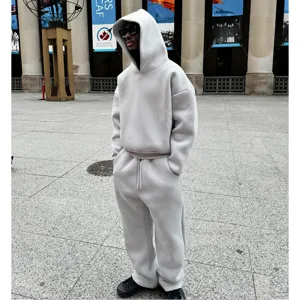 Solid color loose fleece hoodie and sweatpants streetwear tracksuit set for casual daily wear.