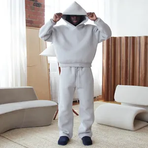 Casual loose solid color hoodie and sweatpants set, comfortable minimalist streetwear style.