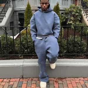 Detailed street view showcasing heavy solid streetwear hoodie and pants with web design shoes.