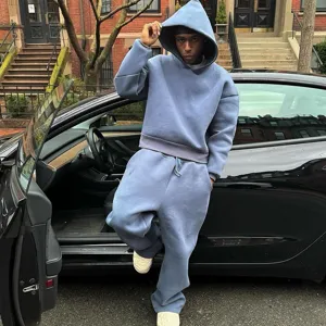 Detailed outdoor street style view of the solid loose casual hoodie and sweatpants set.