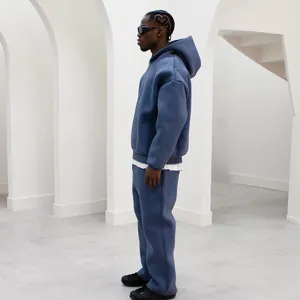 Casual solid color hooded sweatshirt and sweatpants set for men and women, loose fit.