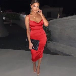 Detail view of elegant red satin slip dress, highlighting cowl neck and midi length style.