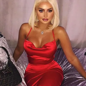 Close-up detail of the red satin slip dress showcasing the elegant cowl neck design.