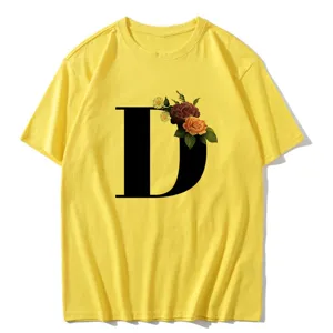 Yellow short sleeve women t-shirt featuring a large black letter D with vintage floral print.