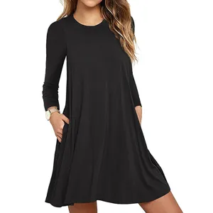 Solid color long sleeve pocket dress detail view, casual black A-line mini swing dress.
