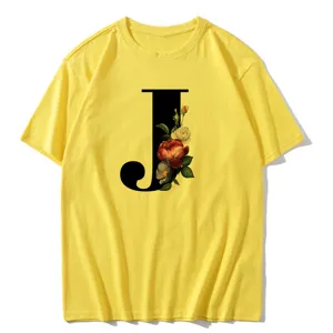 Close-up view of the yellow short sleeve T-shirt featuring a chic floral letter J print.