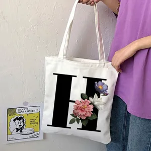 Borsa shopper in tela con lettera H e stampa floreale, comoda borsa a tracolla casual.
