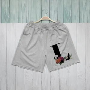 Casual gynaikeia shorts se gkri chroma me kompsh mauri grammh L kai floral print.