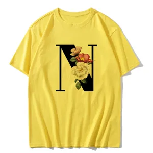 Detailed view of yellow casual short-sleeve t-shirt featuring elegant floral letter N print.