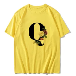 Detail view of a yellow short-sleeve T-shirt featuring a vintage floral letter Q print.
