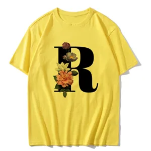 Casual yellow short-sleeve t-shirt featuring a stylish floral letter R graphic print design.
