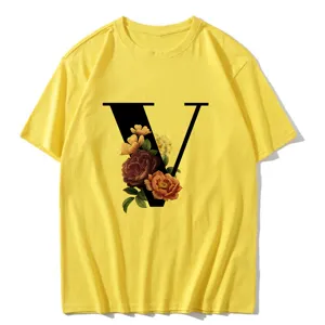 Detailed view of the yellow short sleeve t-shirt featuring a vintage floral letter V design.