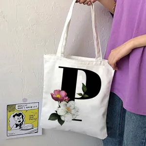 Borsa shopper in tela bianca con lettera P nera e stampa floreale, borsa a spalla casual.