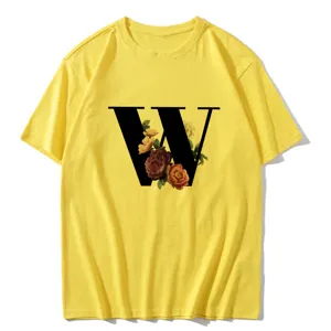 Yellow short sleeve t-shirt featuring a large black letter W with vintage floral print design.