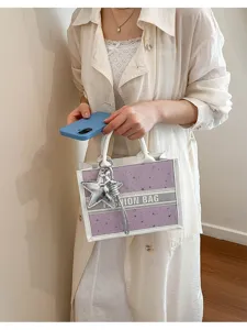 Chic purple white star print tote bag with stylish charm and handles for women fashion daily.