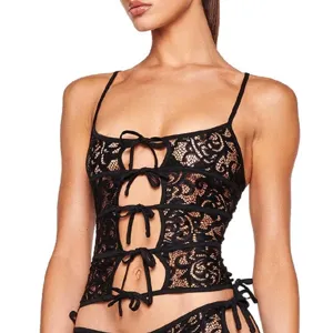 Black lace camisole detail featuring front cutout design and delicate ribbon tie closures.