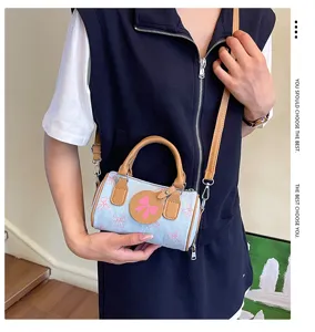 Cute denim bow cylinder handbag for women, trendy stylish single shoulder crossbody bag.