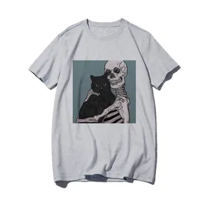 Close-up detail of the skeleton and black cat graphic print on the casual grey t-shirt fabric.