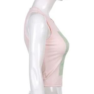 Pink sleeveless crop top with green graphic print, fitted slim design for casual summer wear.