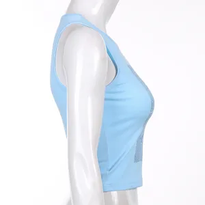 Light blue sleeveless crop top featuring a chic front graphic print, perfect for summer casual wear.