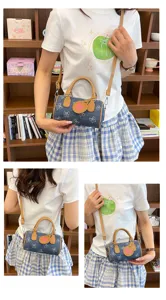 Cute denim bow print barrel handbag for women, stylish shoulder crossbody bag with top handle.