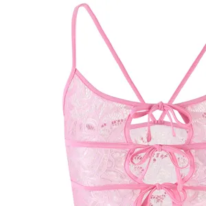 Pink lace camisole top detail, sexy Y2K aesthetic with multiple bow knots and spaghetti straps.