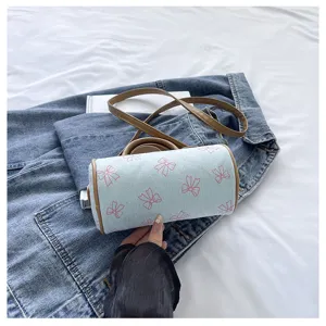 Cute denim bow cylindrical handbag, stylish women's single shoulder crossbody messenger bag.