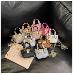 Schicke mehrfarbige Mini-Handtaschen mit Griff für Mädchen, stilvolle Leder-Umhängetaschen.