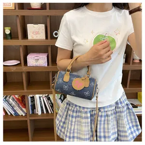 Cute denim bow print barrel bag, casual shoulder crossbody bag for women, stylish daily wear accessory.