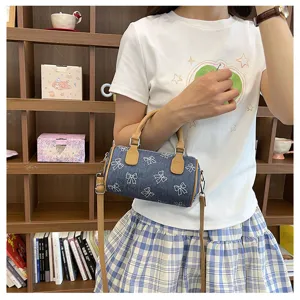 Cute denim bow print barrel bag, trendy single shoulder crossbody handbag for women daily.