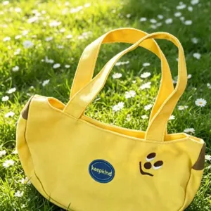 Canvas handbag detail view, cute yellow tote bag with embroidery design for daily commute.