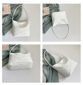 White star print shoulder bag detail view, stylish PU leather underarm bag close-up.
